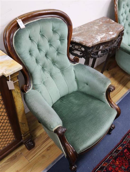 A Victorian buttoned-back armchair and a similar chair